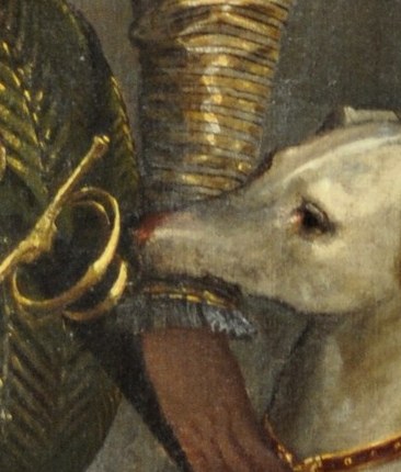 The relaxed drape of fingers signals aristocratic ease; Veronese uses the hand to anchor the composition's right edge and echo the greyhound's slender form.