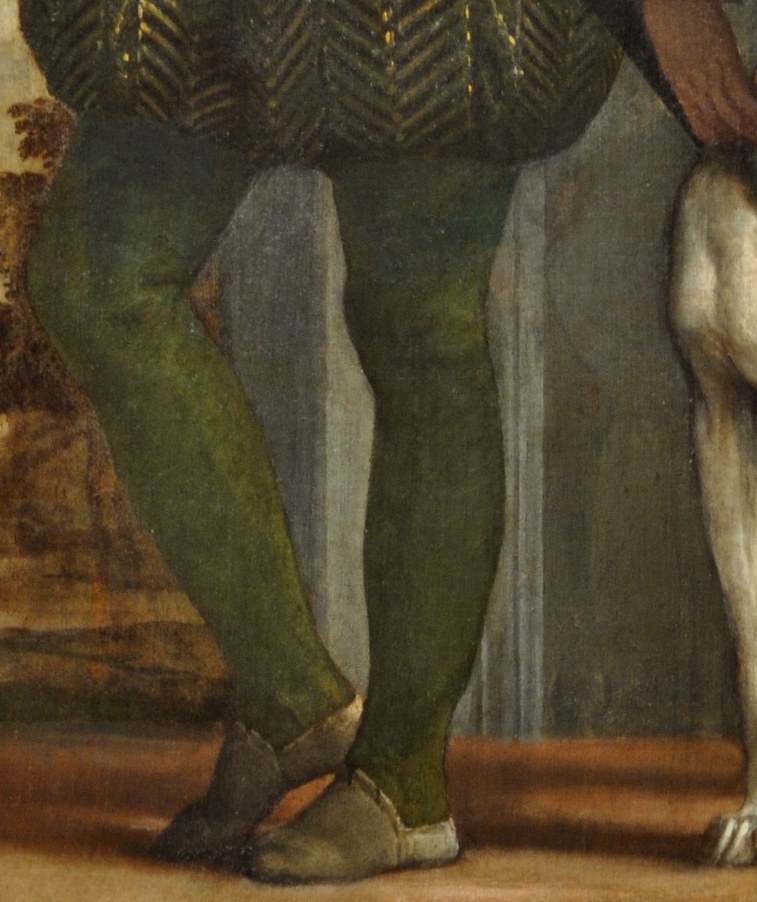 His greyhound signals noble breeding, a faithful companion.