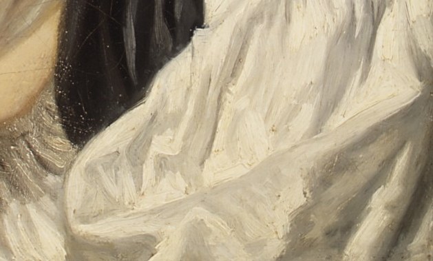 See how the light catches the ruffled collar of her dress.