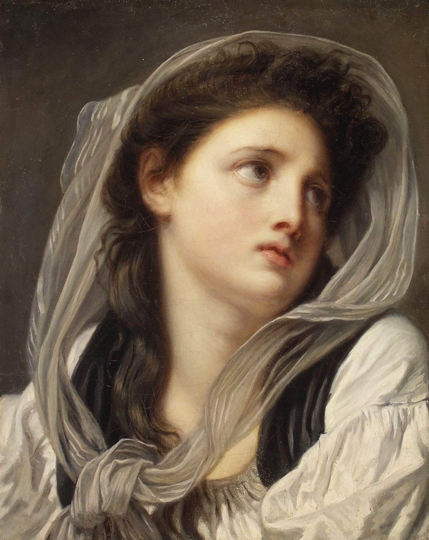 But the real trick is the sheer, gauzy veil over her hair.