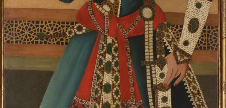 Look closely at the woven sash that binds his robe.