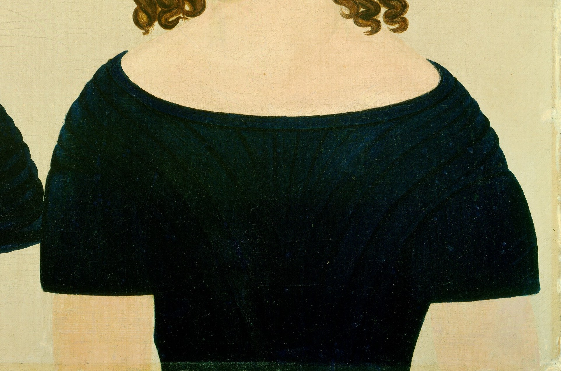 They wear identical dresses with off-the-shoulder sleeves.