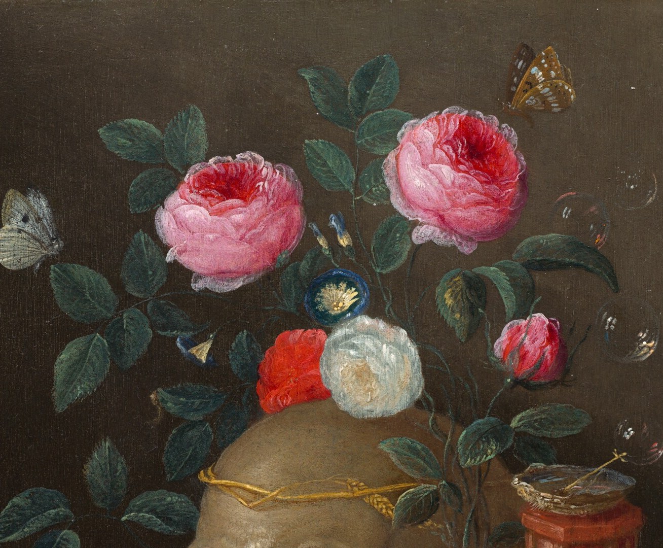 Lush blooms at peak beauty positioned directly above the skull , the pairing enacts the vanitas message that beauty, like life, is fleeting