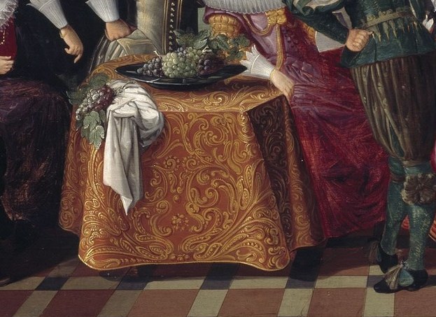 The table of fruit. In Dutch painting, this signals prosperity.