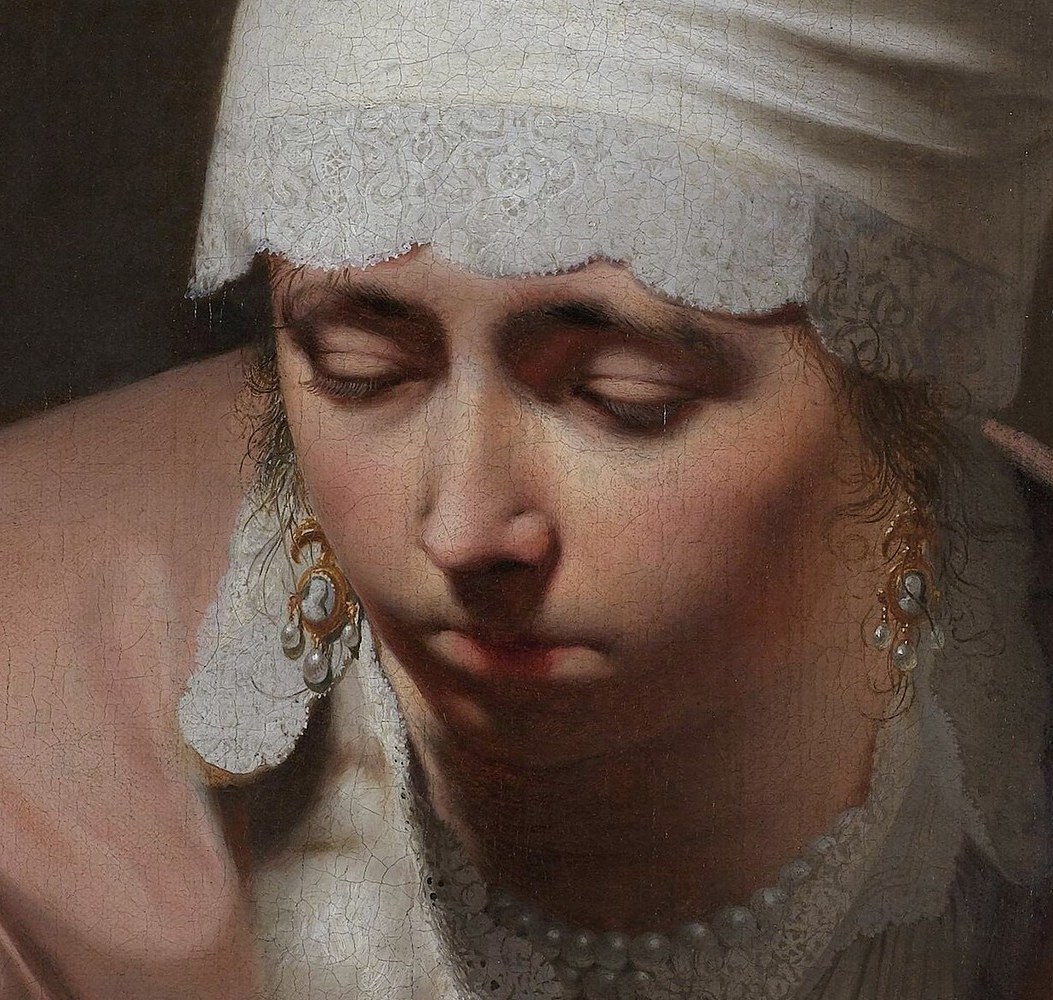 She closes her eyes, seeking comfort from the cold.