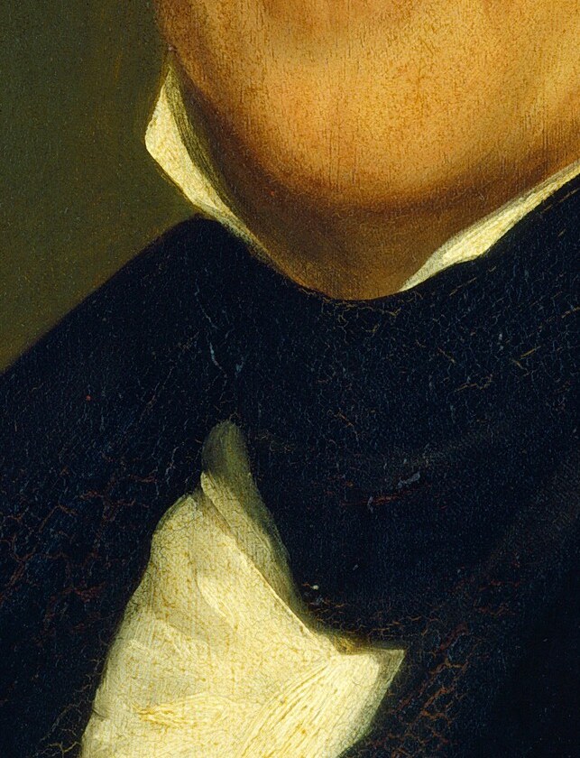 His crisp white cravat shows meticulous attention to presentation.