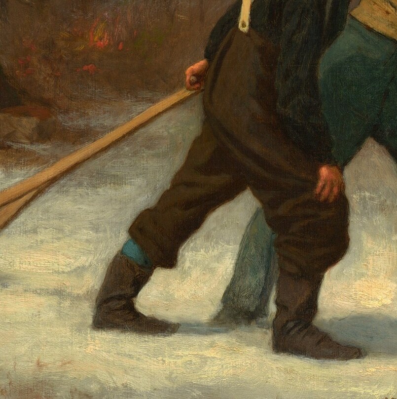 One man pulls, his back bent against the weight.