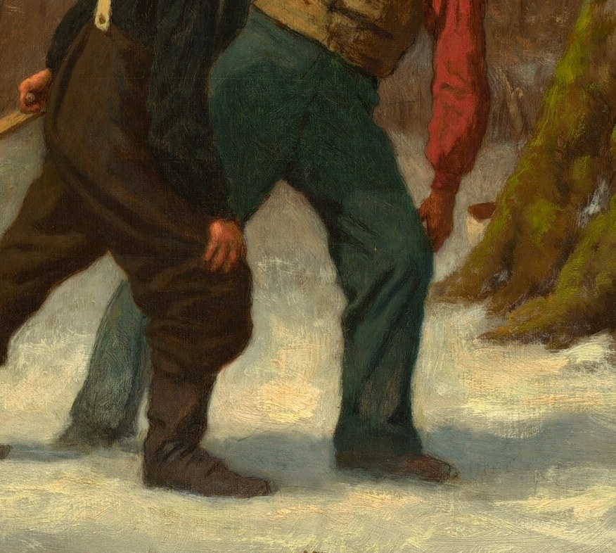 The other pushes, his face showing the strain of the work.