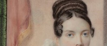 The intricate styling of her hair indicates contemporary fashion and attention to personal grooming.