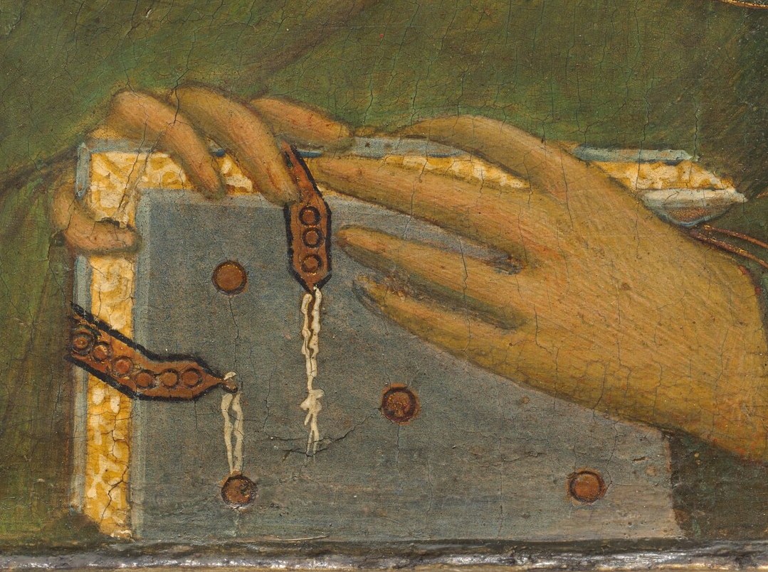 Look at the careful rendering of his hands, holding a sacred text.