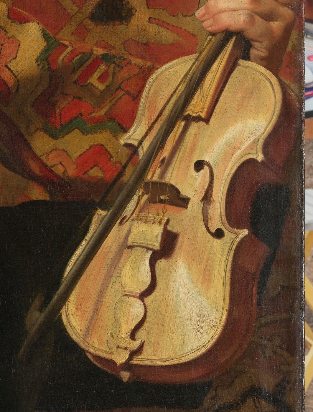 The instrument is held ready to play, its polished surface reflecting light, symbolizing the musician's skill and the joy of music.