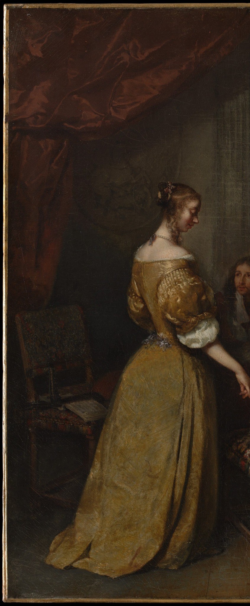 The most luminous figure in the composition; her warm gold dress anchors the left half and signals wealth, functioning as a social-class marker in this Dutch leisure scene.