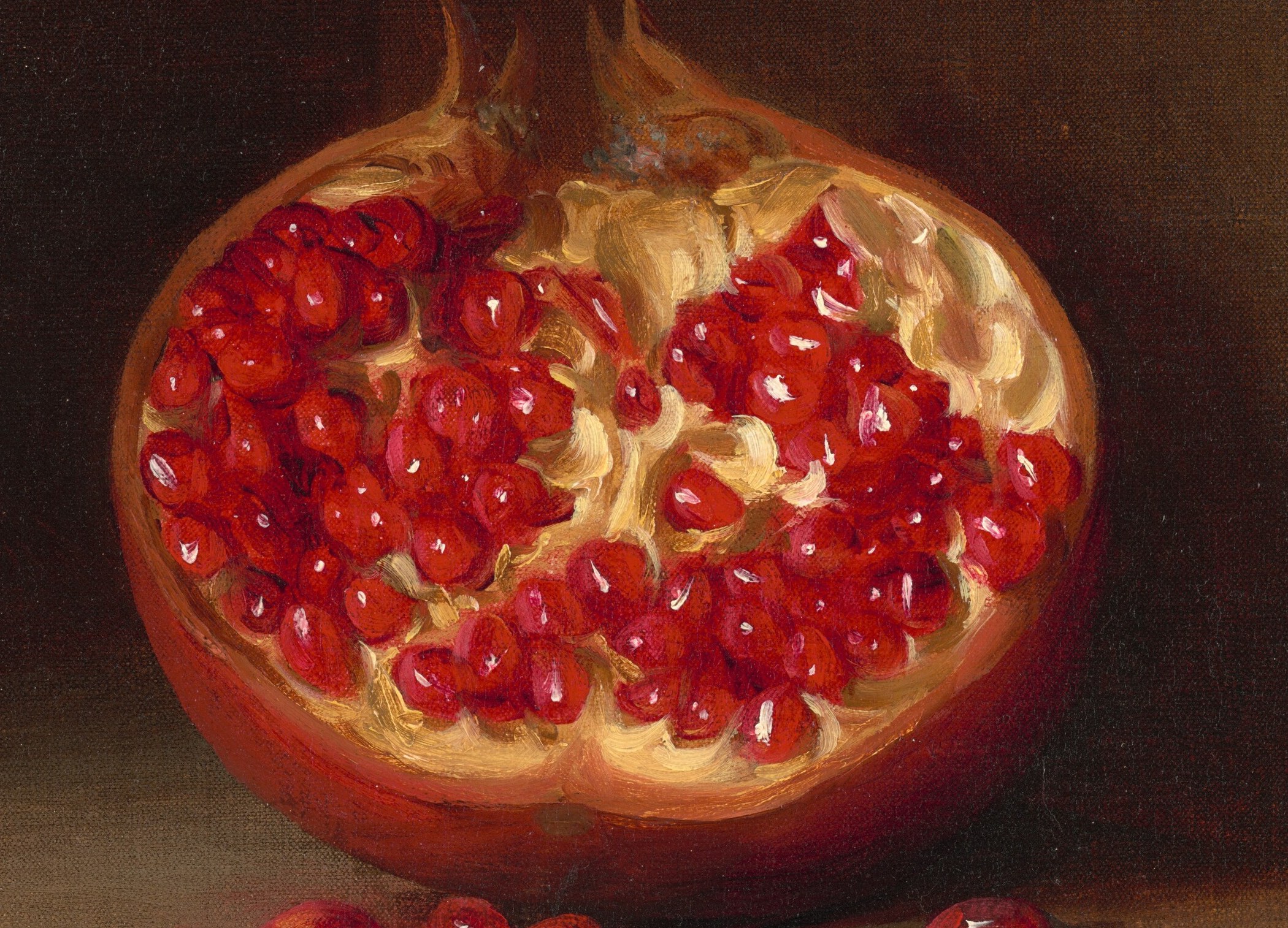 The vibrant red seeds and creamy white pith create a striking contrast, inviting a closer look at the fruit's texture and ripeness.