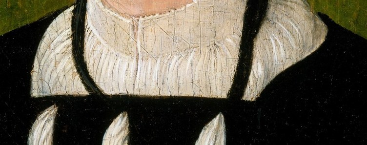 The finely pleated white collar stands out against his dark clothing, highlighting the texture and richness of the fabric.