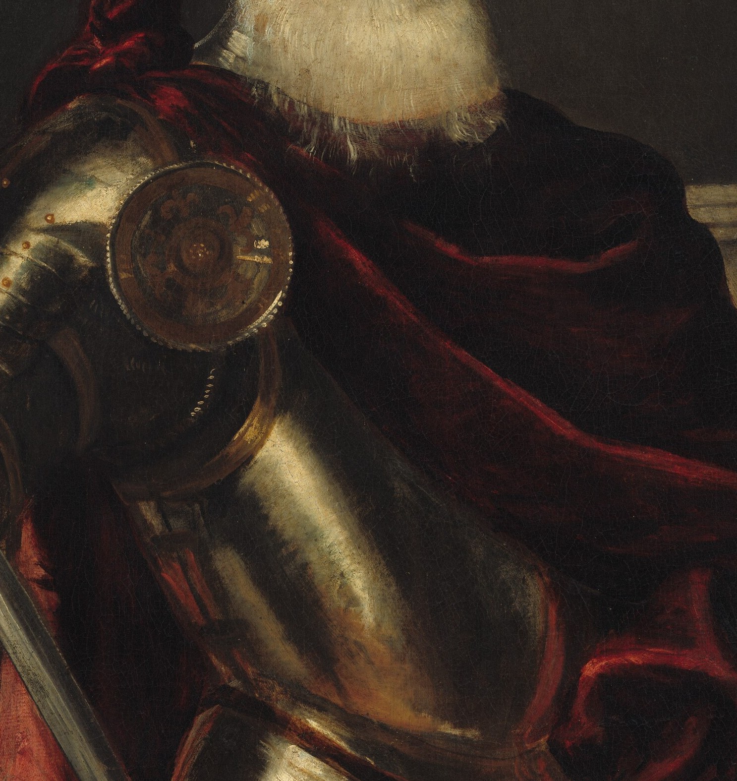 The silver breastplate shines. The crimson cloak announces his rank.