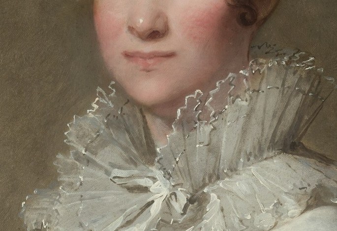 Look closely at the delicate lace of her collar.