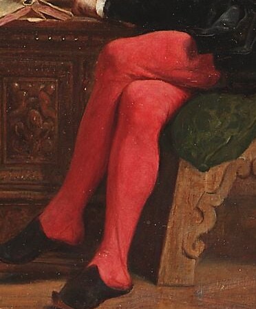 The striking color draws attention to his legs and adds a touch of unexpected vibrancy to the otherwise somber attire.