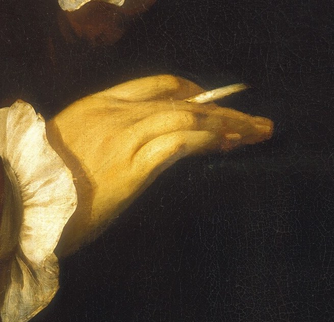 And a quill pen, poised as if he's about to write.