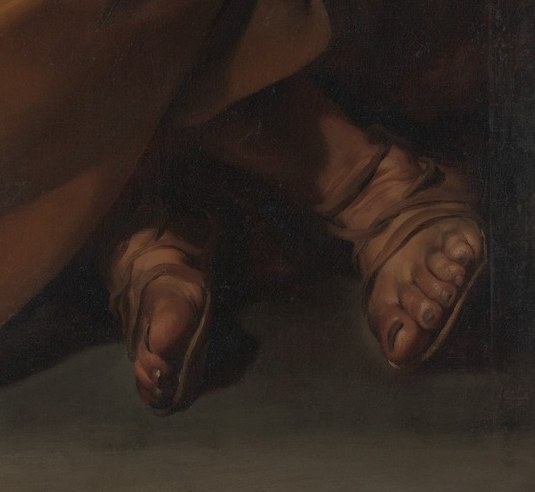 His bare feet ground him in grief.