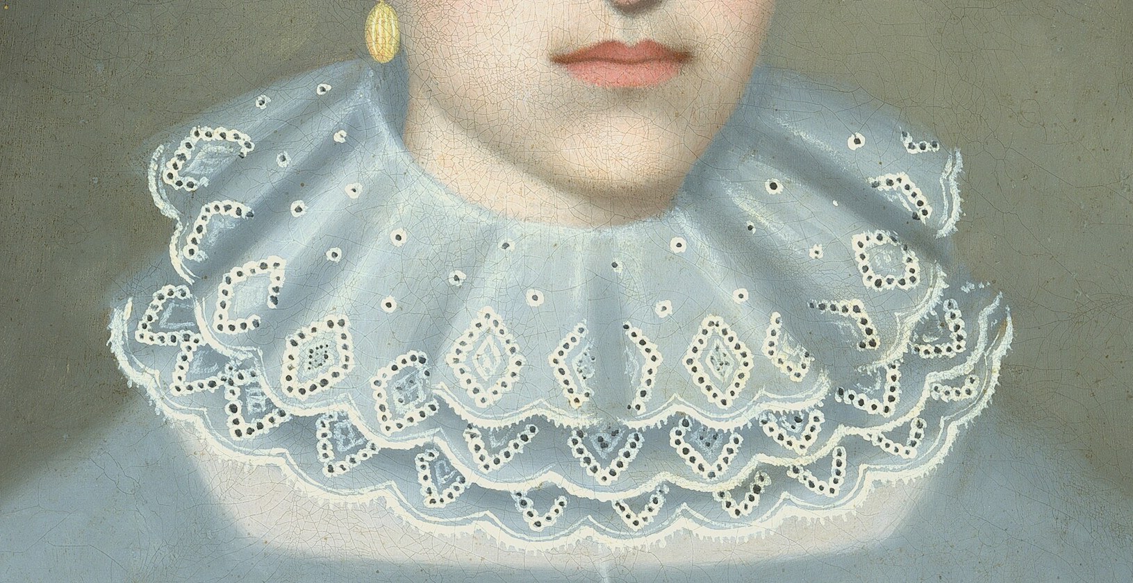 Her delicate lace collar signals wealth and social standing.