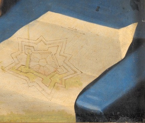 Look closely at the document on the table.