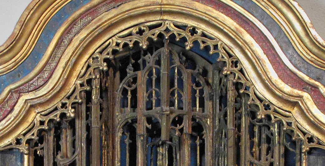 Look past her, through the carved columns and arches.