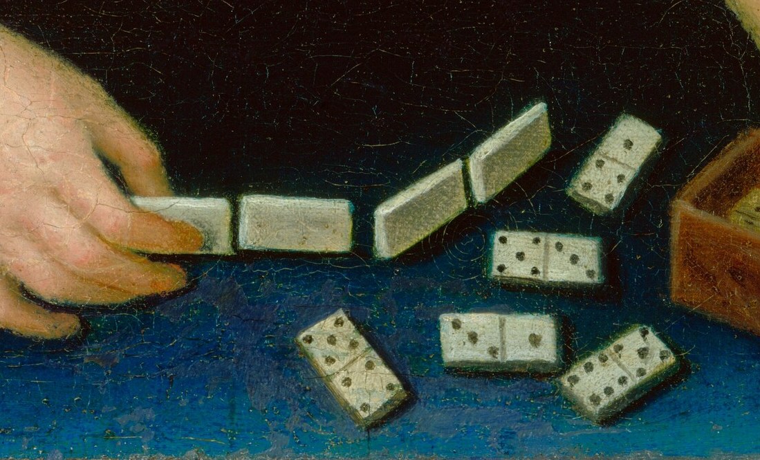 These are the central objects of her attention, showing the game in progress and the tactile nature of play.
