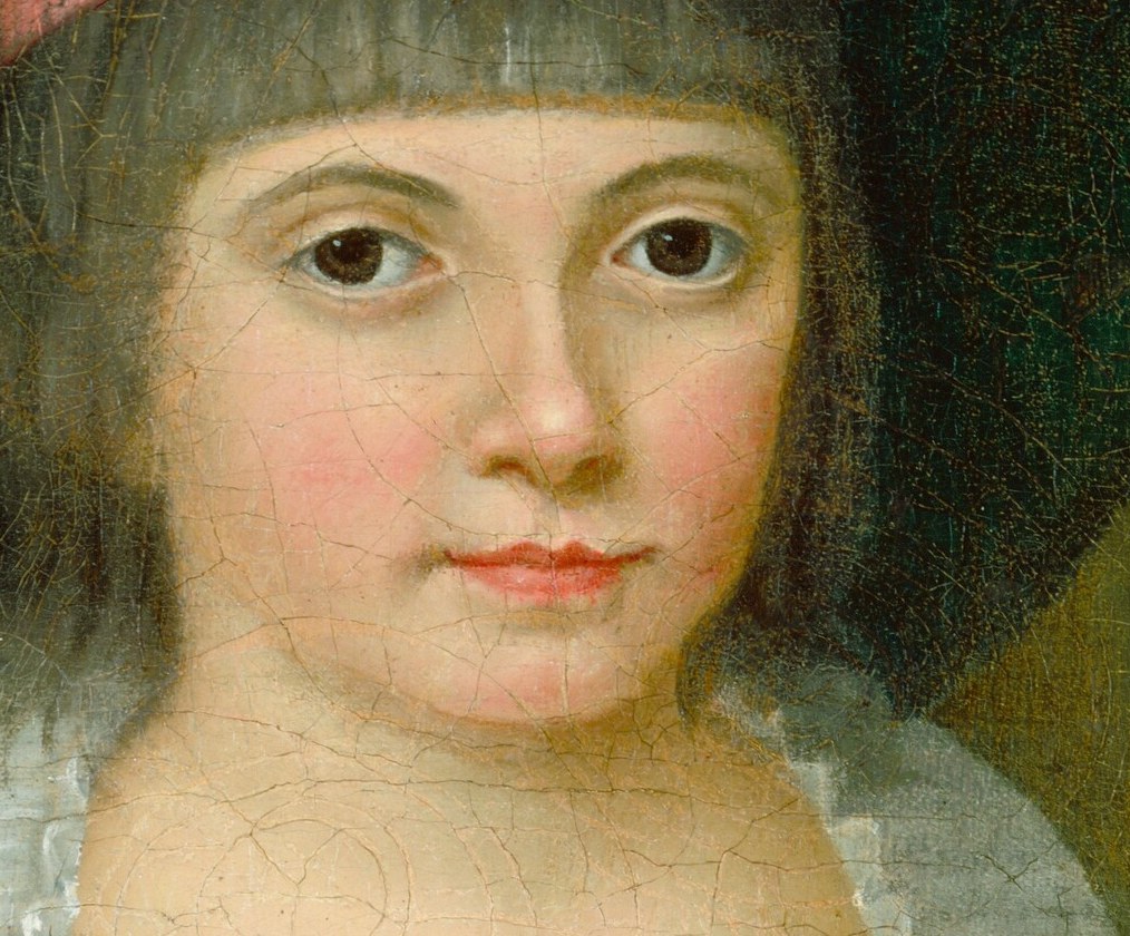 Her face is blurred, almost a mystery.
