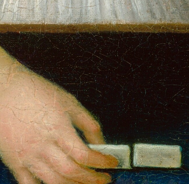 Her hands carefully consider the next move.