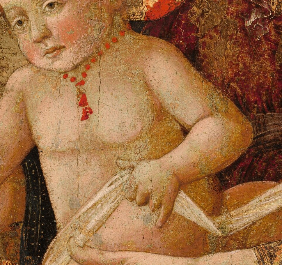 The child's coral necklace was an amulet against illness and evil.
