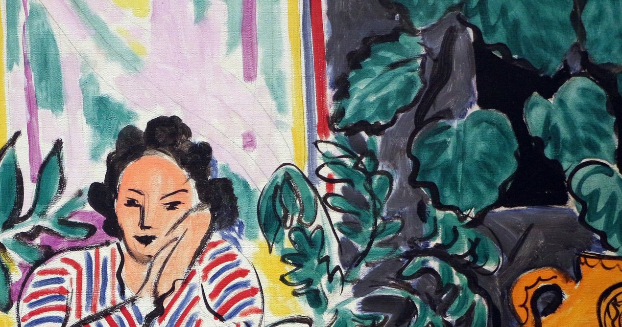 Through the window, abstract colors suggest a vibrant world.