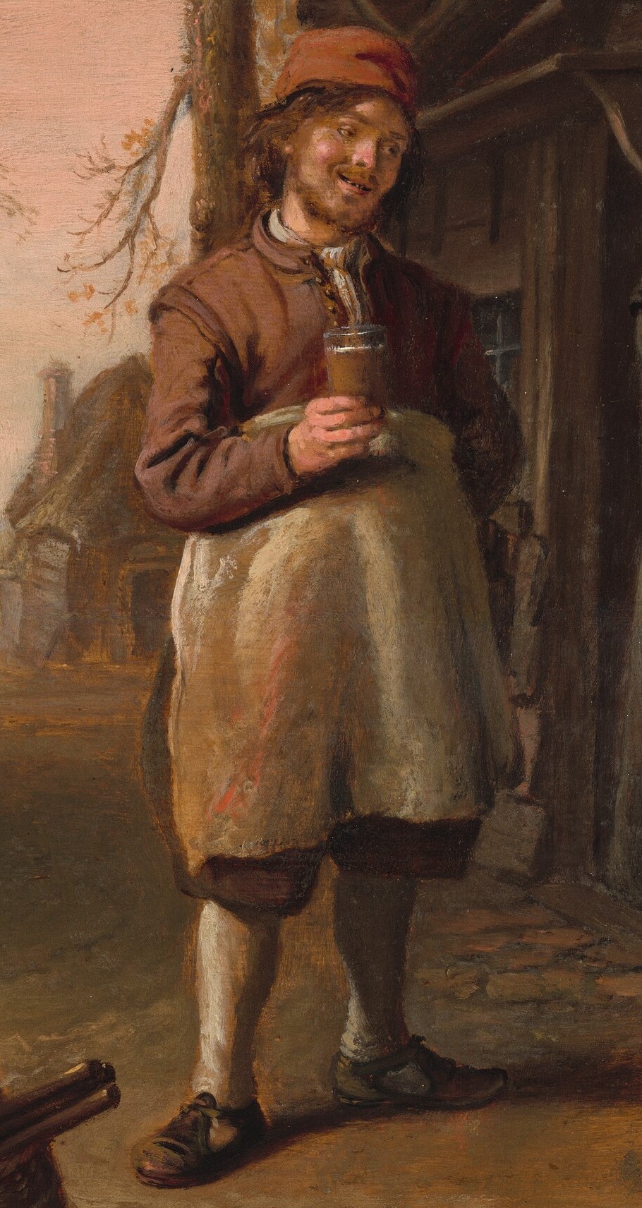 His cheerful expression and drink suggest a communal, perhaps celebratory, aspect to the task.