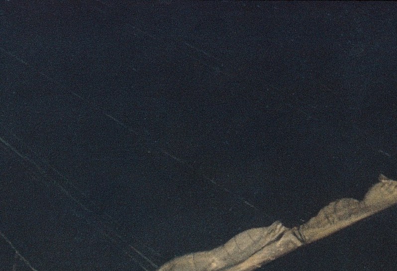 The single brightest passage in the painting; its diagonal sweep against the dark sky creates the dominant compositional thrust and suggests wind off the river