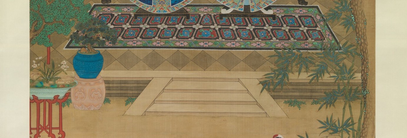 The patterned textile draping the dais carries its own decorative program of auspicious motifs; the platform's height physically elevates the couple above the viewer.