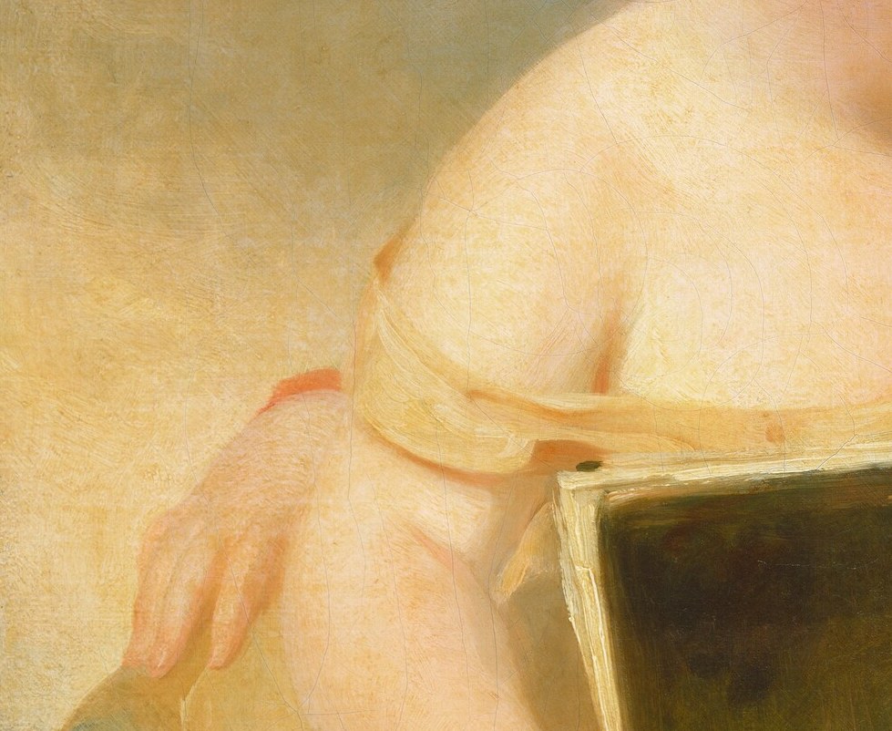 See the bare shoulder of the child on the left.