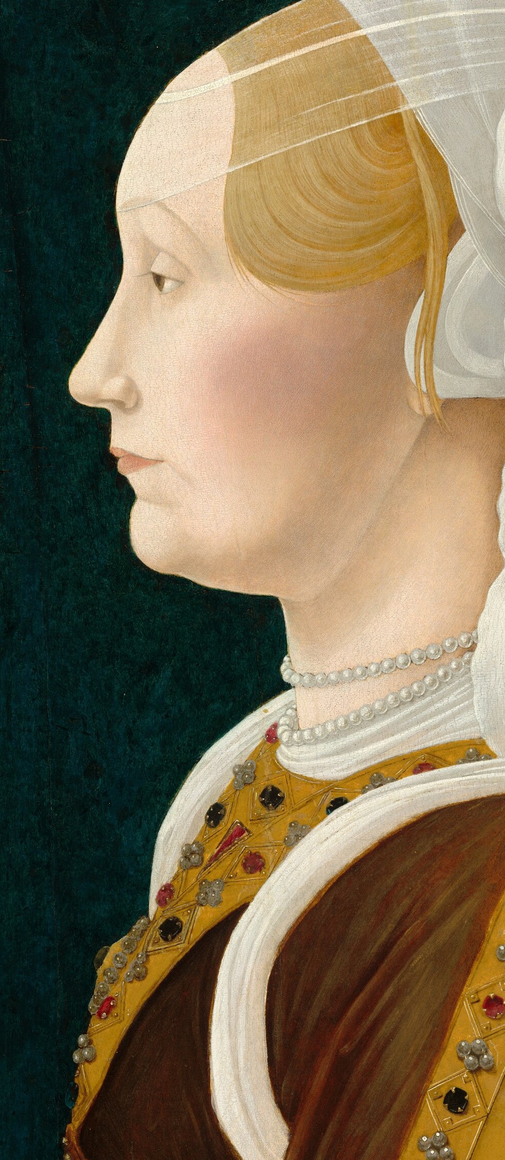 Her strict profile was a style popular in 15th-century Italian art.