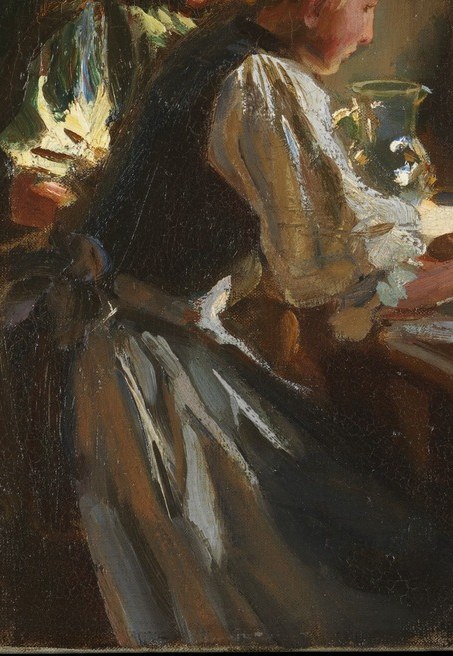 The quiet woman at the table seems lost in thought.