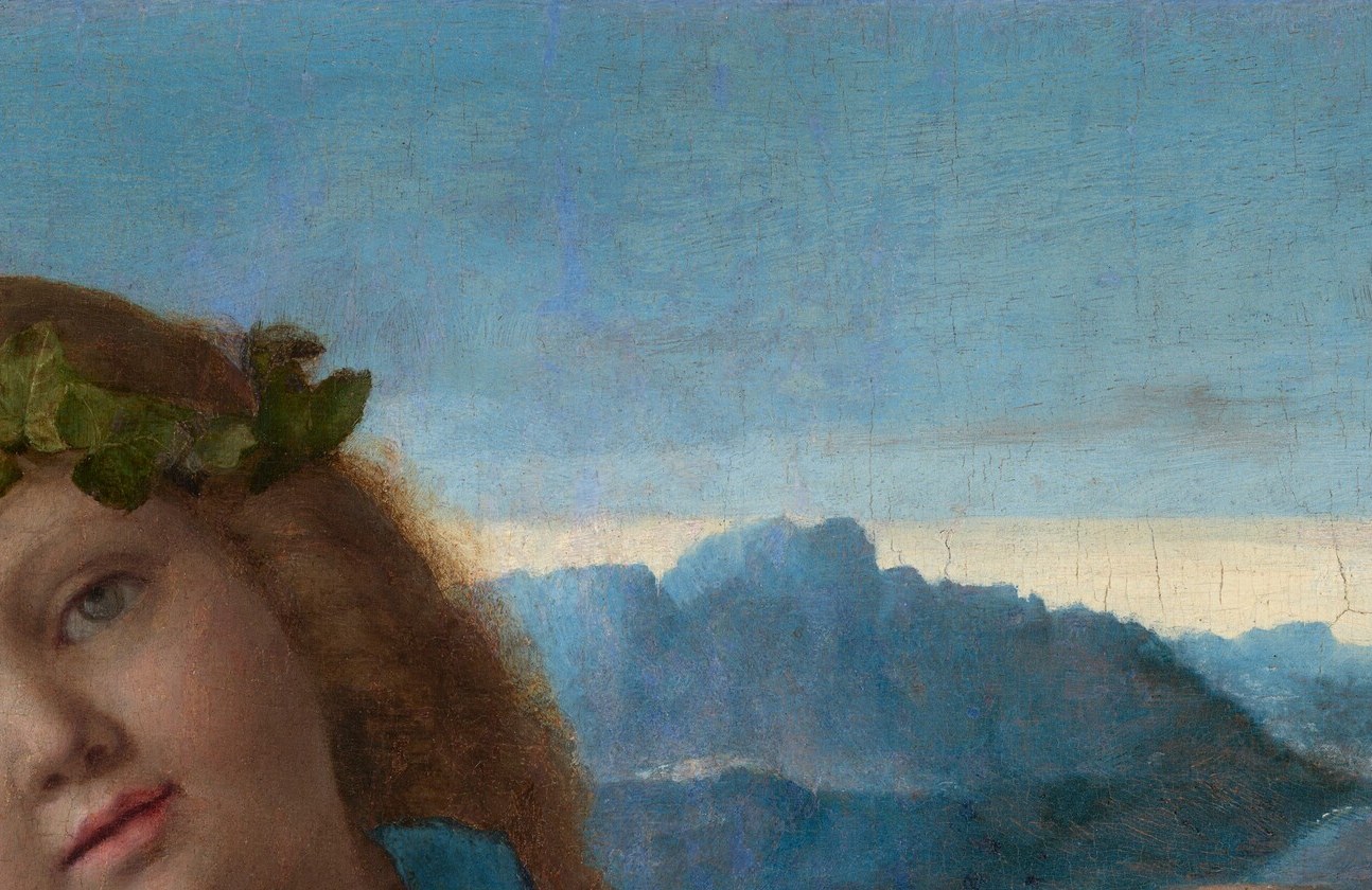 The ivy crown is Bacchus's principal attribute, linking the child to divinity and to themes of seasonal renewal and the winter-solstice metaphor scholars read into this work
