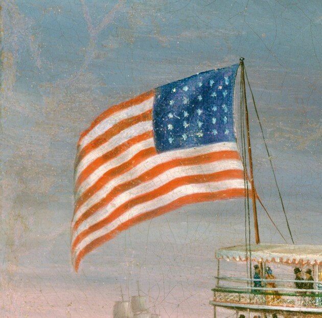 Symbol of national pride and the vessel's identity, waving defiantly in the rough seas.