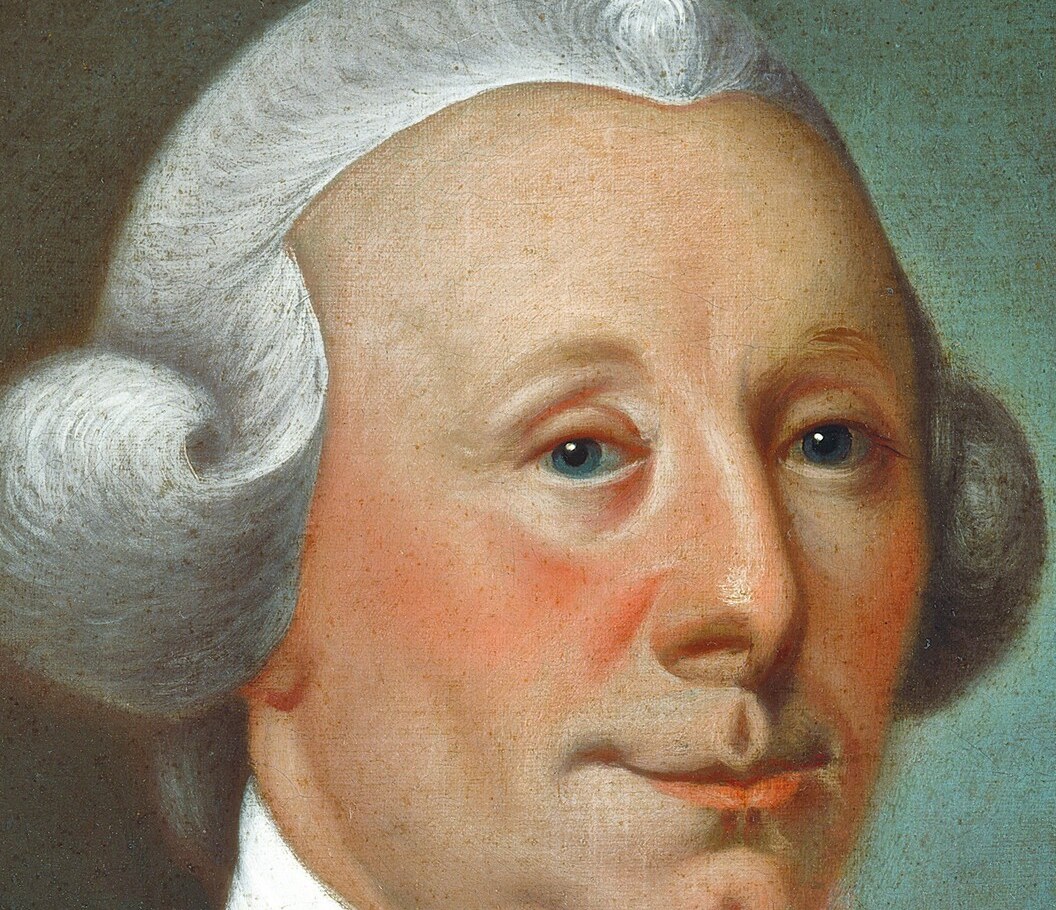 The neatly styled hair indicates a concern for appearance and social decorum.