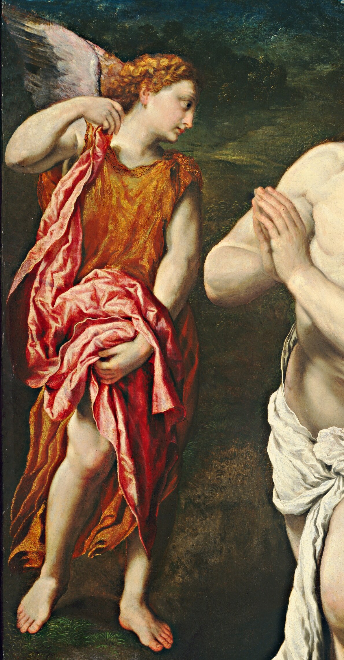 The angel beside him wears a fiery red robe.