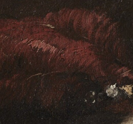 Her elaborate red headdress suggests status and wealth.