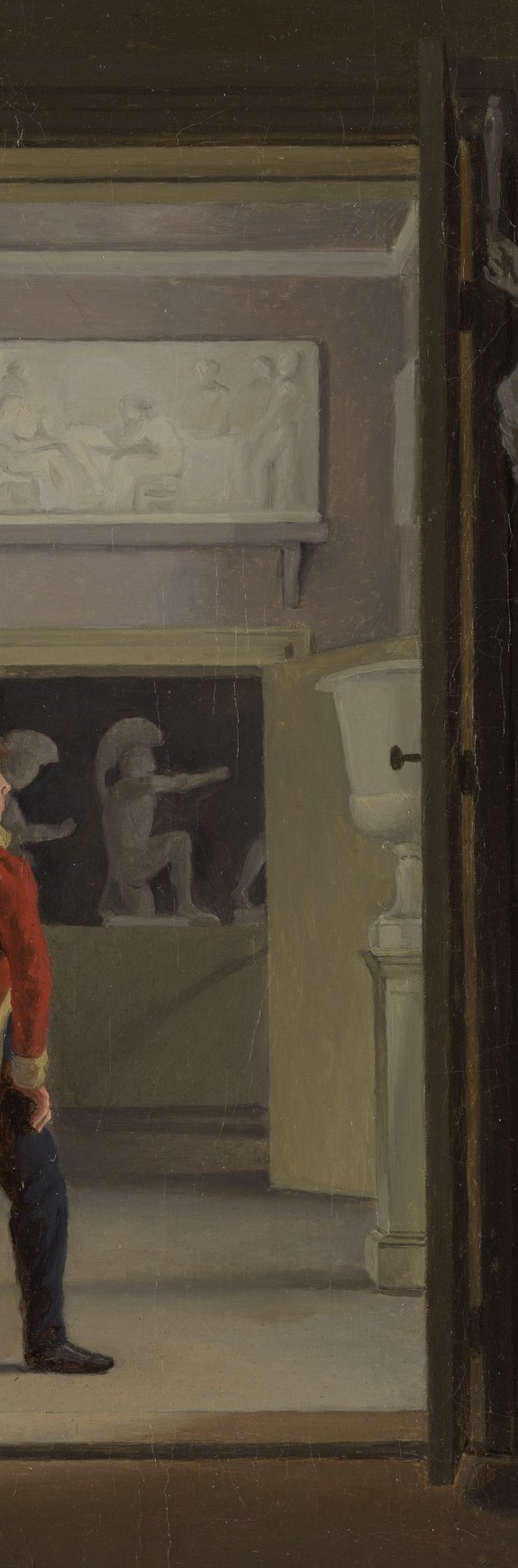 Look through the bright doorway behind him.
