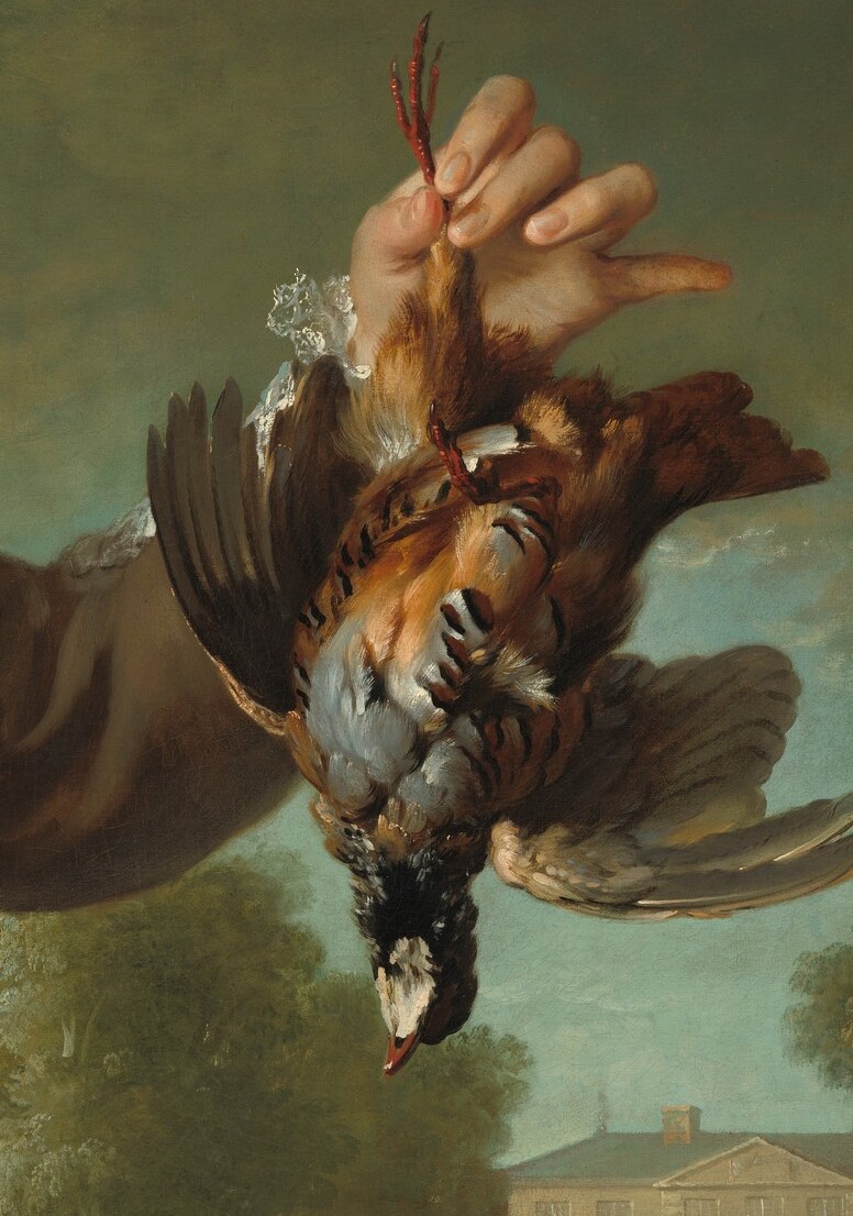 The chevalier holds a game bird from his hunt.