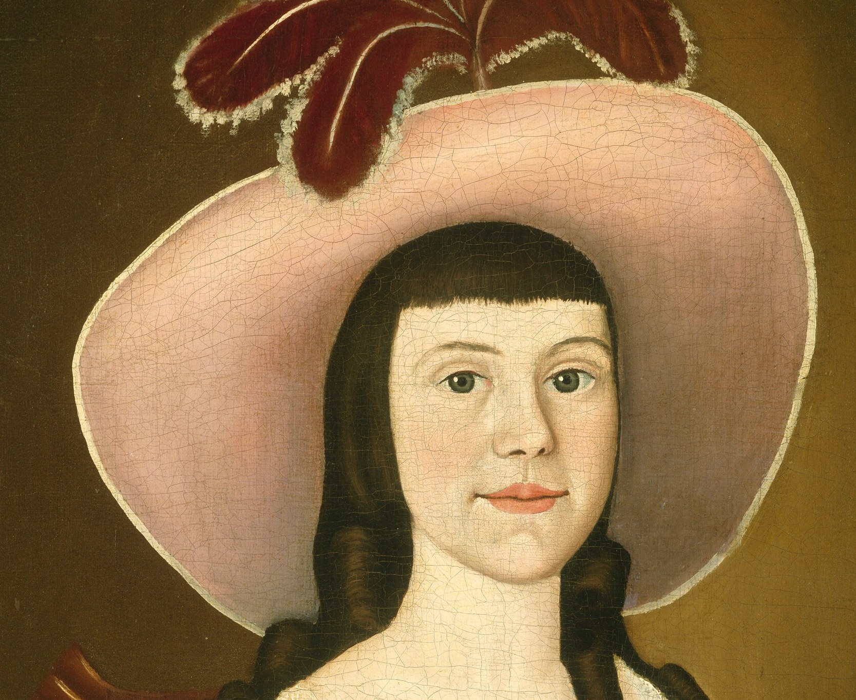 The hat's dramatic size and soft pink hue frame her face and suggest fashion and status.