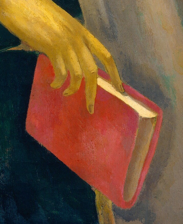 She holds a red book, a vibrant focal point of her devotion.