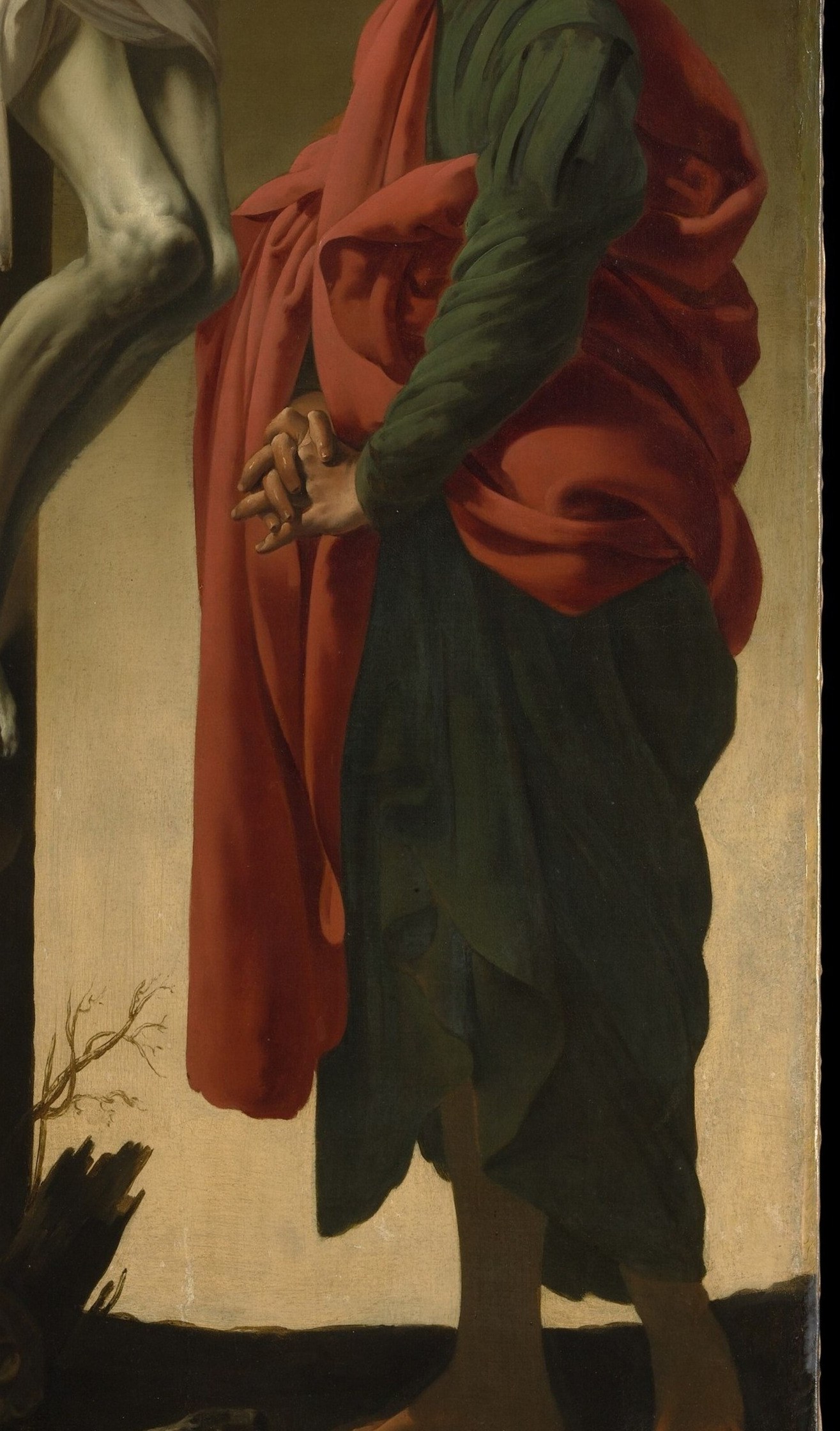The saturated vermilion-red is the painting's most aggressive color note and blazes against the dark void , a Caravaggist compositional anchor that would have been startling in a small candlelit hidden church.
