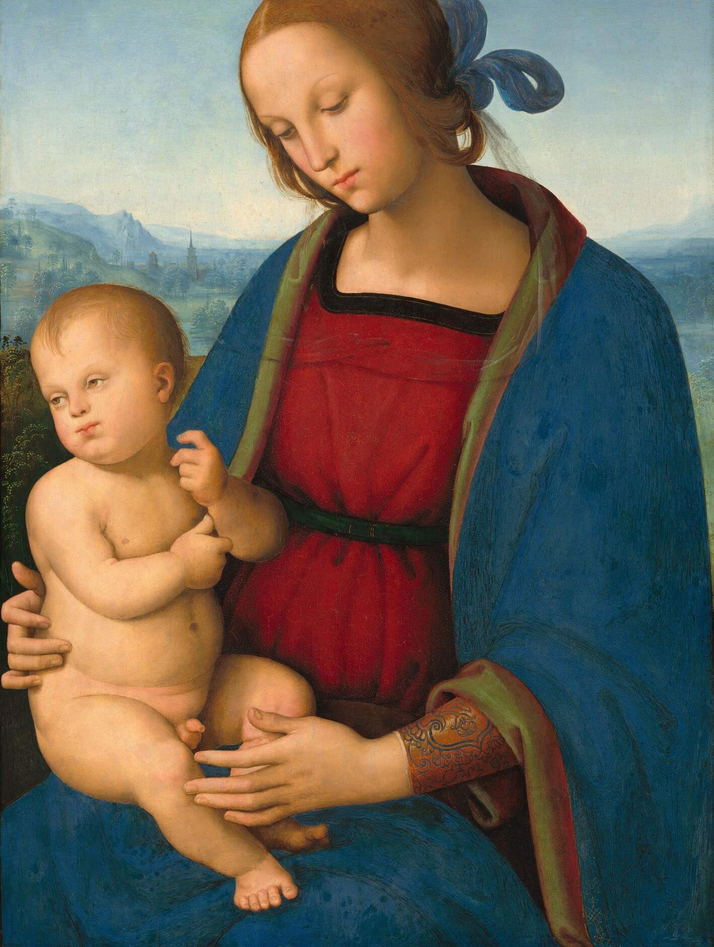 ultramarine blue of exceptional depth; the way it wraps and folds demonstrates Perugino's mastery of cloth volumes in oil