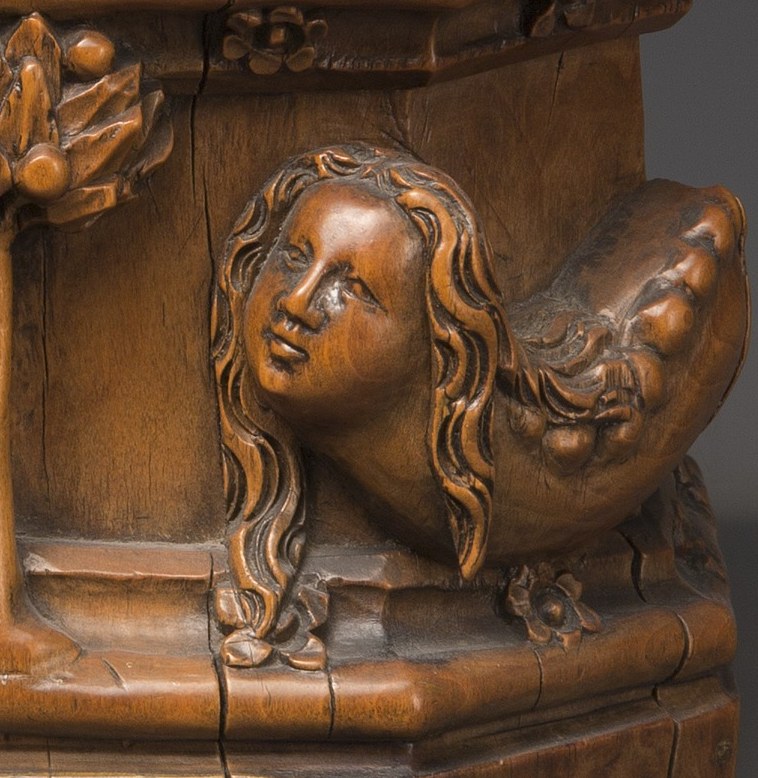 This girl holds a serpent, a symbol of temptation.