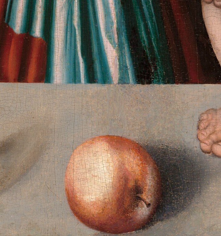 The apple (malum = apple/evil in Latin) is the fruit of the Fall placed deliberately near the grapes of Redemption , a compact visual argument that Christ reverses original sin.